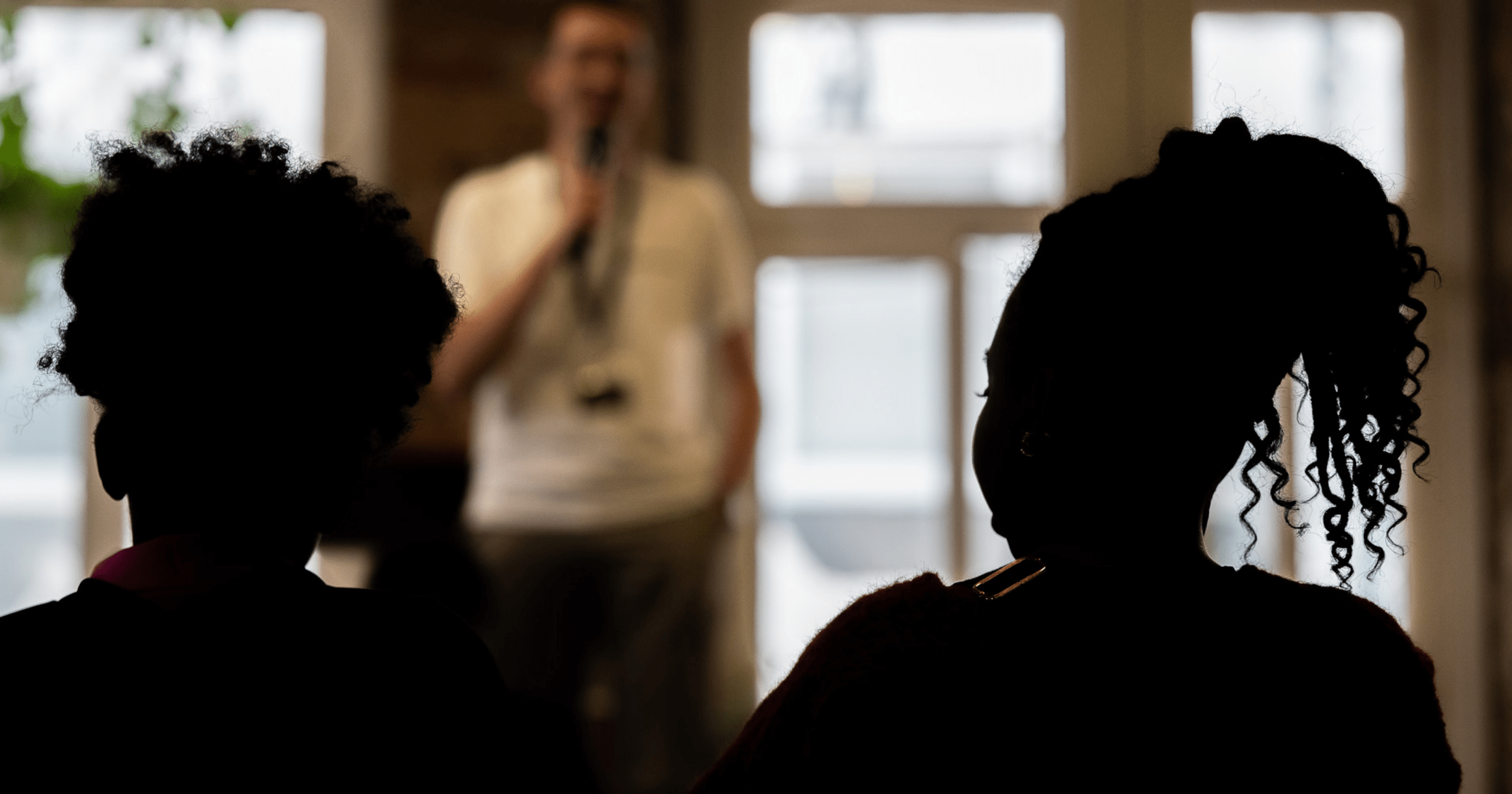 Participants listen during a workshop at the AGE Summit